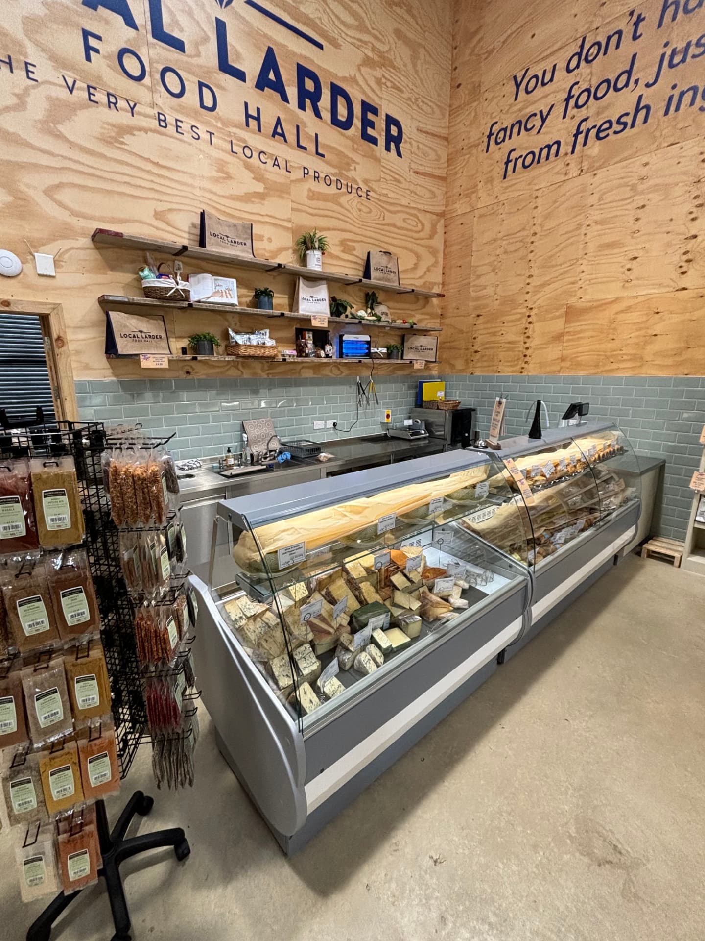 Deli and cheese counter with illuminated serve-over cabinets
